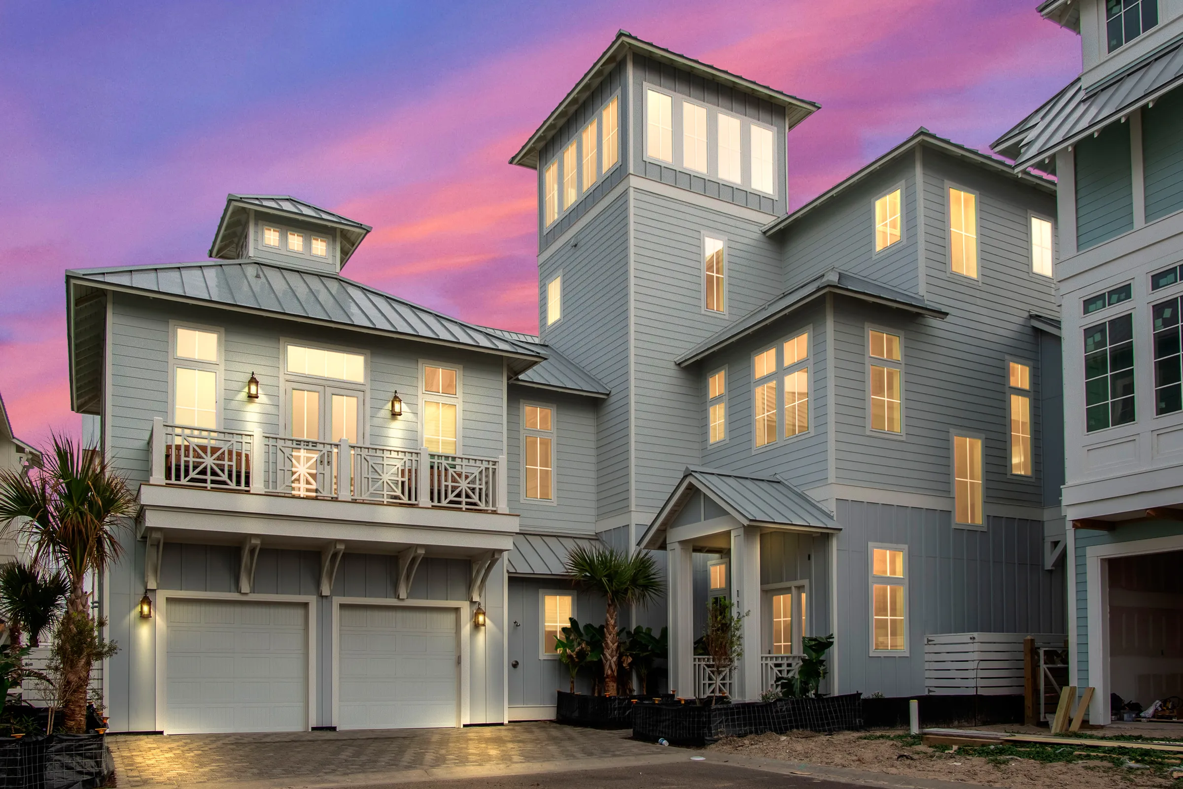 A Cinnamon Shore beach house lit at dusk — Port Aransas, Texas